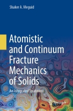 Atomistic and Continuum Fracture Mechanics of Solids - An Integrated Treatment